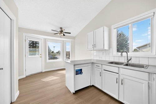143 Applewood Drive Se, Calgary, AB - Indoor Photo Showing Kitchen With Double Sink