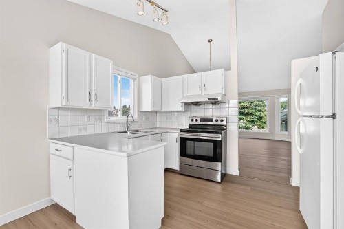 143 Applewood Drive Se, Calgary, AB - Indoor Photo Showing Kitchen With Double Sink