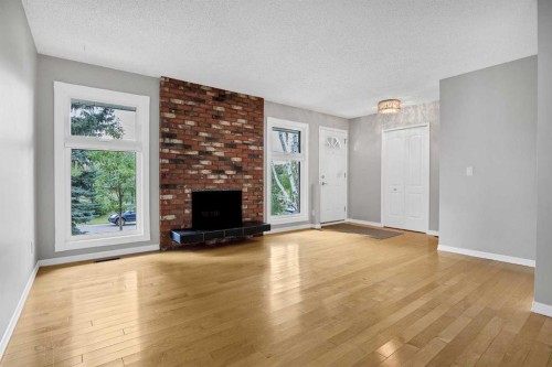 1307 56 Avenue Nw, Calgary, AB - Indoor Photo Showing Living Room With Fireplace