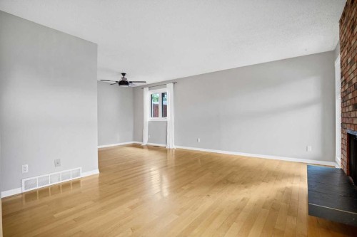 1307 56 Avenue Nw, Calgary, AB - Indoor With Fireplace
