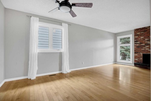 1307 56 Avenue Nw, Calgary, AB - Indoor With Fireplace