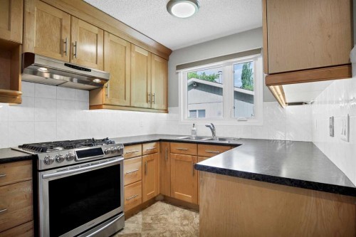 1307 56 Avenue Nw, Calgary, AB - Indoor Photo Showing Kitchen With Double Sink