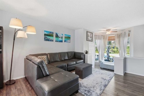 160 Promenade Way Se, Calgary, AB - Indoor Photo Showing Living Room