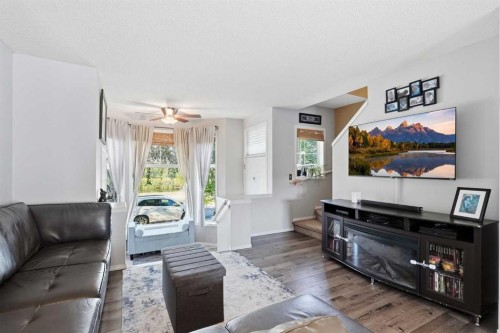 160 Promenade Way Se, Calgary, AB - Indoor Photo Showing Living Room