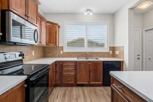 51 Covehaven Mews Ne, Calgary, AB - Indoor Photo Showing Kitchen With Double Sink