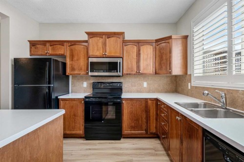 51 Covehaven Mews Ne, Calgary, AB - Indoor Photo Showing Kitchen With Double Sink