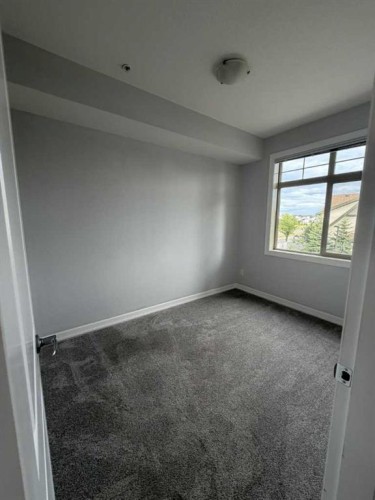 219-117 Copperpond Common Se, Calgary, AB - Indoor Photo Showing Other Room