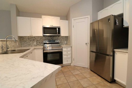 52 Mt Aberdeen Circle Se, Calgary, AB - Indoor Photo Showing Kitchen With Stainless Steel Kitchen With Double Sink