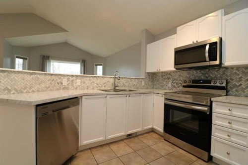52 Mt Aberdeen Circle Se, Calgary, AB - Indoor Photo Showing Kitchen With Double Sink