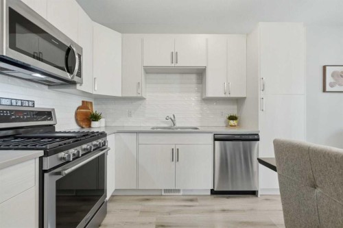 535 Canals Crossing Sw, Airdrie, AB - Indoor Photo Showing Kitchen With Stainless Steel Kitchen