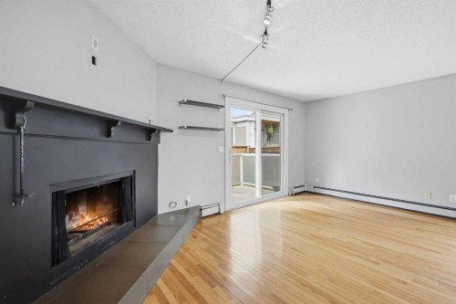 B-2115 35 Avenue Sw, Calgary, AB - Indoor With Fireplace