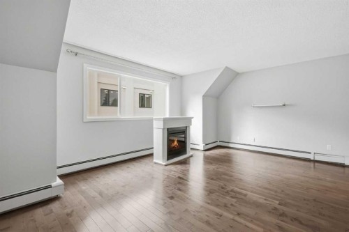 B-2115 35 Avenue Sw, Calgary, AB - Indoor With Fireplace