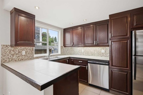 B-2115 35 Avenue Sw, Calgary, AB - Indoor Photo Showing Kitchen With Stainless Steel Kitchen With Double Sink