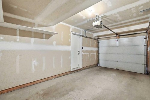 209 Copperpond Row Se, Calgary, AB - Indoor Photo Showing Garage