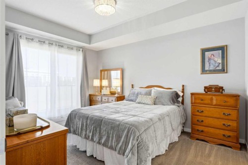 212-4150 Seton Drive Sw, Calgary, AB - Indoor Photo Showing Bedroom