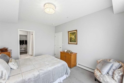 212-4150 Seton Drive Sw, Calgary, AB - Indoor Photo Showing Bedroom
