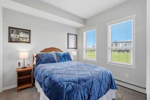 212-4150 Seton Drive Sw, Calgary, AB - Indoor Photo Showing Bedroom