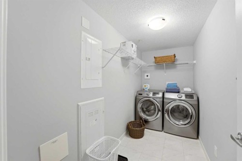 212-4150 Seton Drive Sw, Calgary, AB - Indoor Photo Showing Laundry Room
