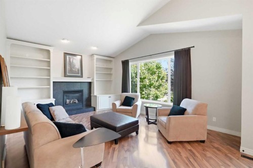 18 Panatella Terrace Nw, Calgary, AB - Indoor Photo Showing Living Room With Fireplace