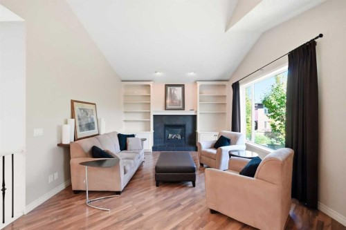 18 Panatella Terrace Nw, Calgary, AB - Indoor Photo Showing Living Room With Fireplace