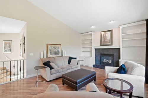 18 Panatella Terrace Nw, Calgary, AB - Indoor Photo Showing Living Room With Fireplace