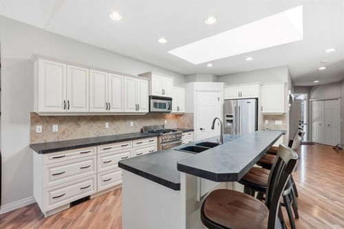 18 Panatella Terrace Nw, Calgary, AB - Indoor Photo Showing Kitchen With Double Sink With Upgraded Kitchen