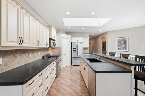 18 Panatella Terrace Nw, Calgary, AB - Indoor Photo Showing Kitchen With Double Sink