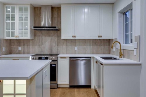 16 Simcrest Point Sw, Calgary, AB - Indoor Photo Showing Kitchen With Double Sink