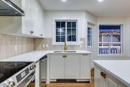 16 Simcrest Point Sw, Calgary, AB - Indoor Photo Showing Kitchen With Double Sink