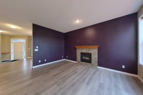 149 Rockborough Green Nw, Calgary, AB - Indoor With Fireplace