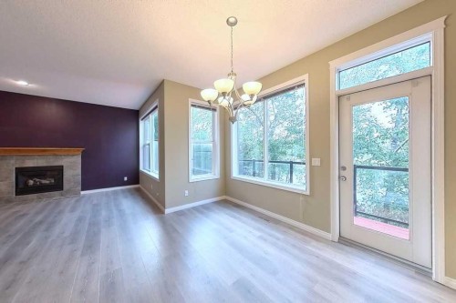 149 Rockborough Green Nw, Calgary, AB - Indoor Photo Showing Other Room With Fireplace