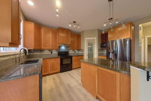 149 Rockborough Green Nw, Calgary, AB - Indoor Photo Showing Kitchen With Double Sink