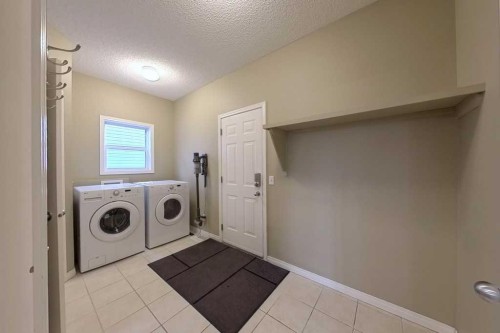 149 Rockborough Green Nw, Calgary, AB - Indoor Photo Showing Laundry Room