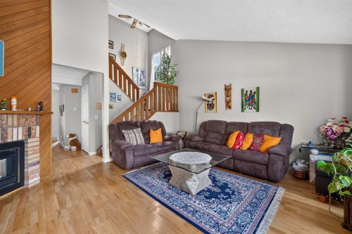 36 Templegreen Bay Ne, Calgary, AB - Indoor Photo Showing Living Room With Fireplace