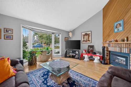 36 Templegreen Bay Ne, Calgary, AB - Indoor Photo Showing Living Room With Fireplace