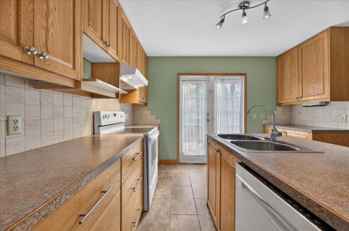 5048 Vanstone Crescent Nw, Calgary, AB - Indoor Photo Showing Kitchen With Double Sink
