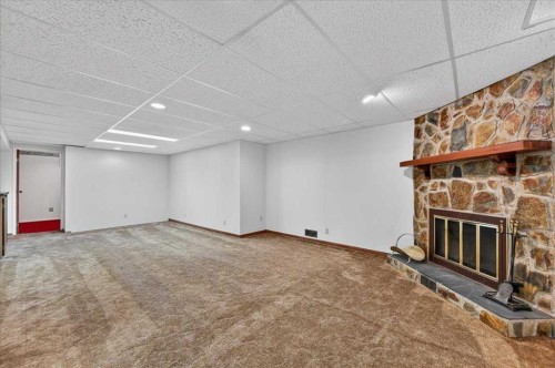 5048 Vanstone Crescent Nw, Calgary, AB - Indoor With Fireplace