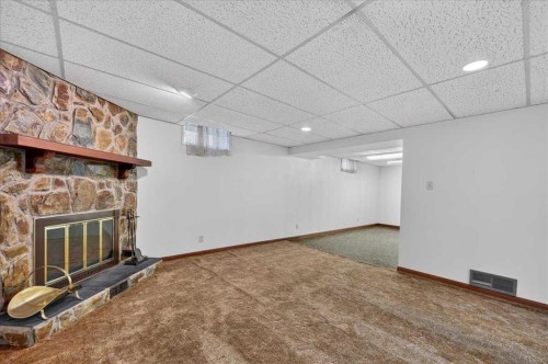 5048 Vanstone Crescent Nw, Calgary, AB - Indoor Photo Showing Other Room With Fireplace