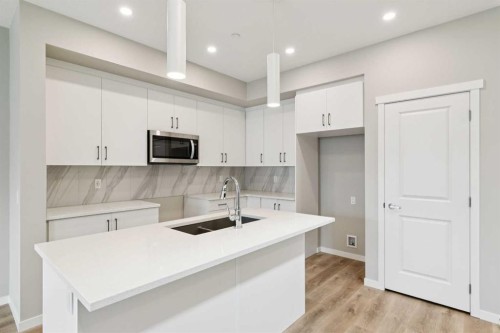 413 Hotchkiss Drive Se, Calgary, AB - Indoor Photo Showing Kitchen With Double Sink