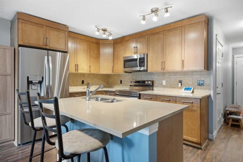 3 Chaparral Valley Gardens Se, Calgary, AB - Indoor Photo Showing Kitchen With Stainless Steel Kitchen With Double Sink
