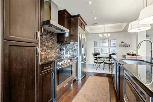 401-131 Quarry Way Se, Calgary, AB - Indoor Photo Showing Kitchen With Upgraded Kitchen