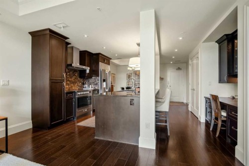 401-131 Quarry Way Se, Calgary, AB - Indoor Photo Showing Kitchen With Upgraded Kitchen