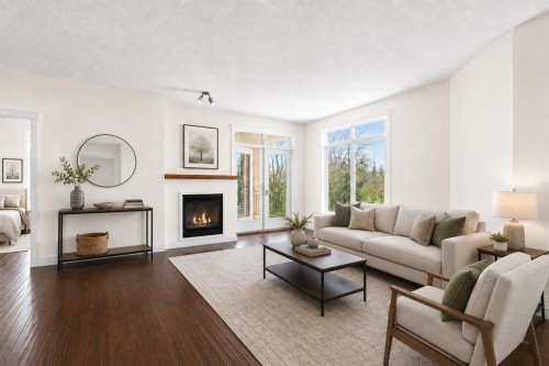 7305-14 Hemlock Crescent Sw, Calgary, AB - Indoor Photo Showing Living Room With Fireplace