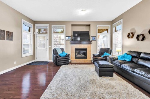 21 Evansfield Way Nw, Calgary, AB - Indoor Photo Showing Living Room With Fireplace