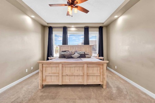 21 Evansfield Way Nw, Calgary, AB - Indoor Photo Showing Bedroom
