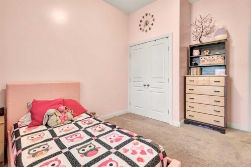 21 Evansfield Way Nw, Calgary, AB - Indoor Photo Showing Bedroom