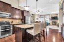 21 Evansfield Way Nw, Calgary, AB  - Indoor Photo Showing Kitchen With Fireplace 