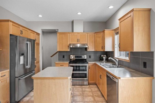 4446 Elgin Avenue Se, Calgary, AB - Indoor Photo Showing Kitchen With Double Sink