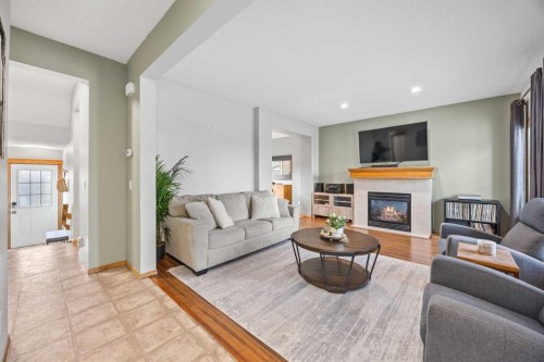 4446 Elgin Avenue Se, Calgary, AB - Indoor Photo Showing Living Room With Fireplace
