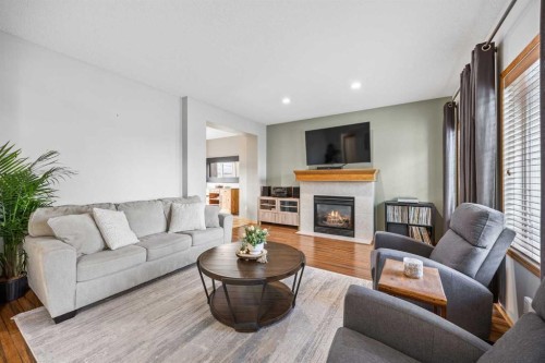 4446 Elgin Avenue Se, Calgary, AB - Indoor Photo Showing Living Room With Fireplace